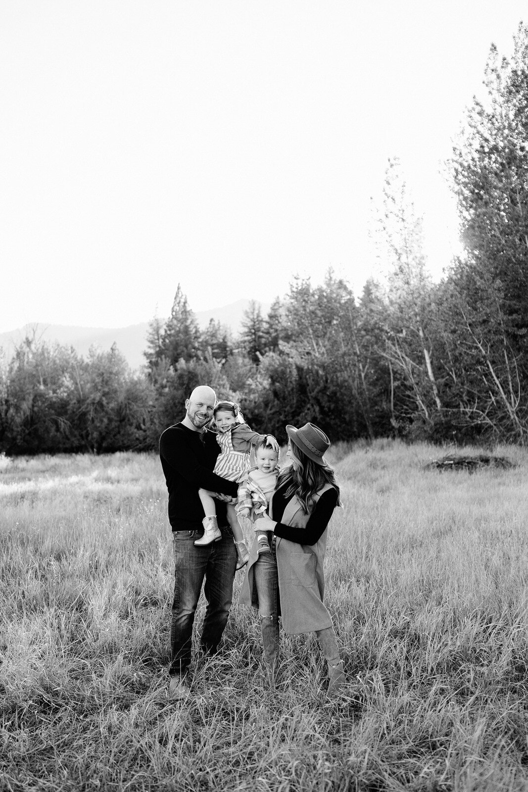 Parents and child in grayscale nature