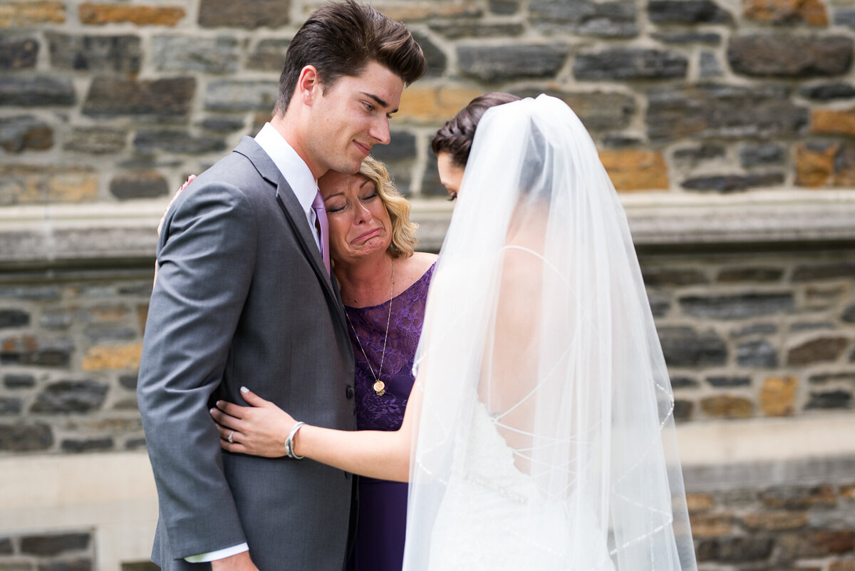 Emotional mother of the bride sees her daughter for the first time in her wedding dress
