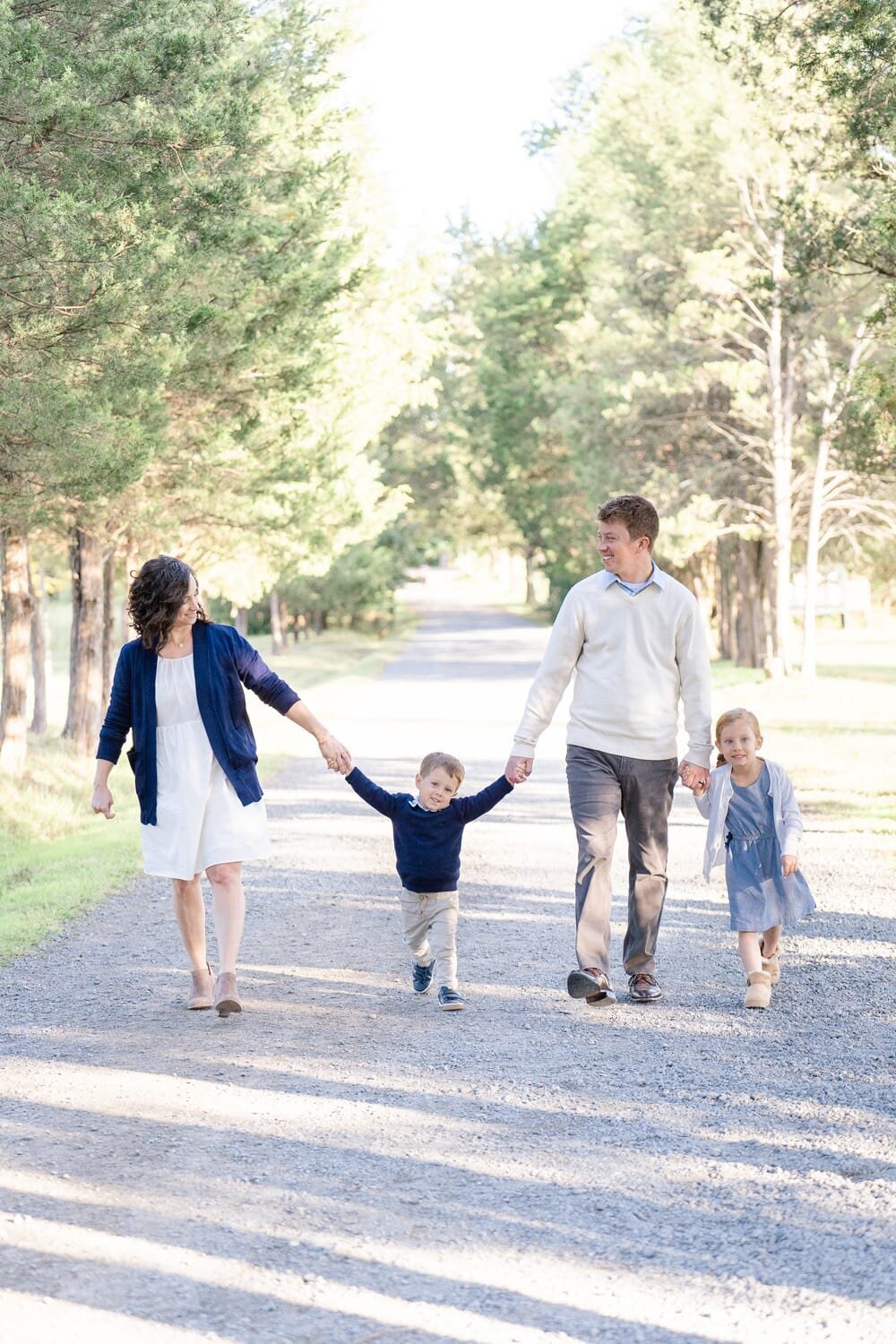 family of 4 walking taken by Sterling, Virginia family photographer