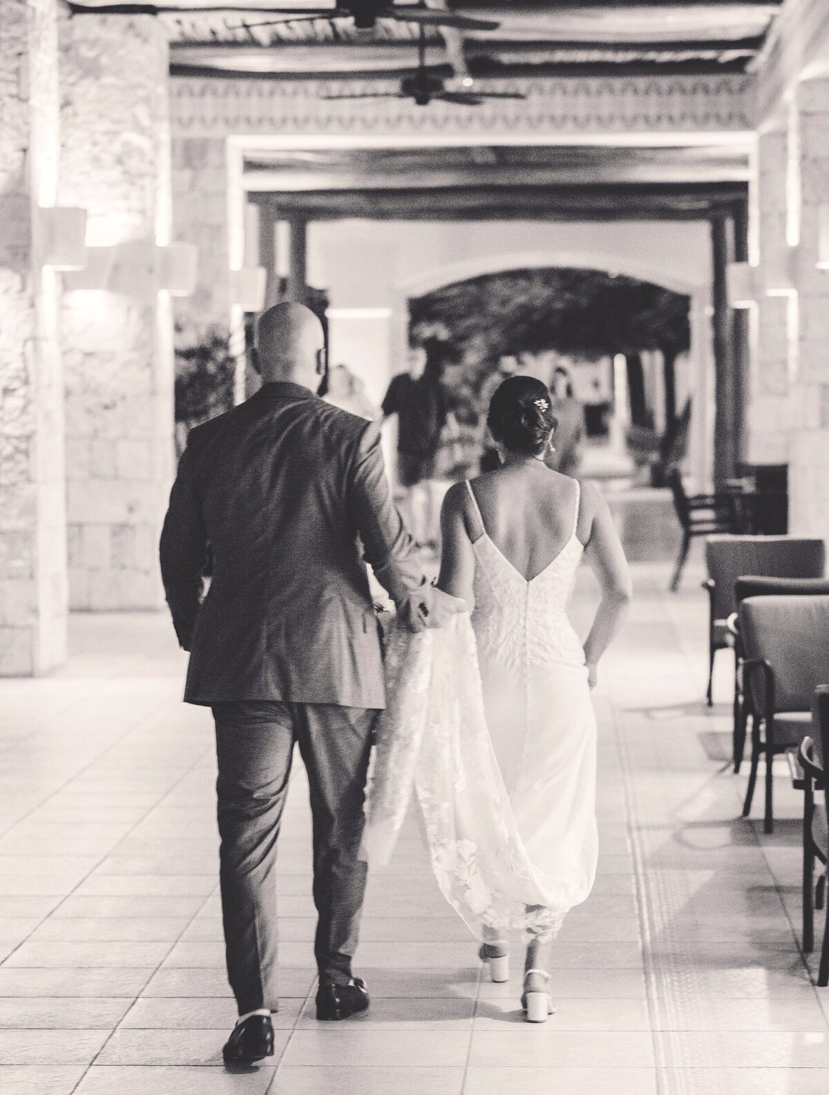 Bride and groom walking to aisle at wedding in Riviera Maya