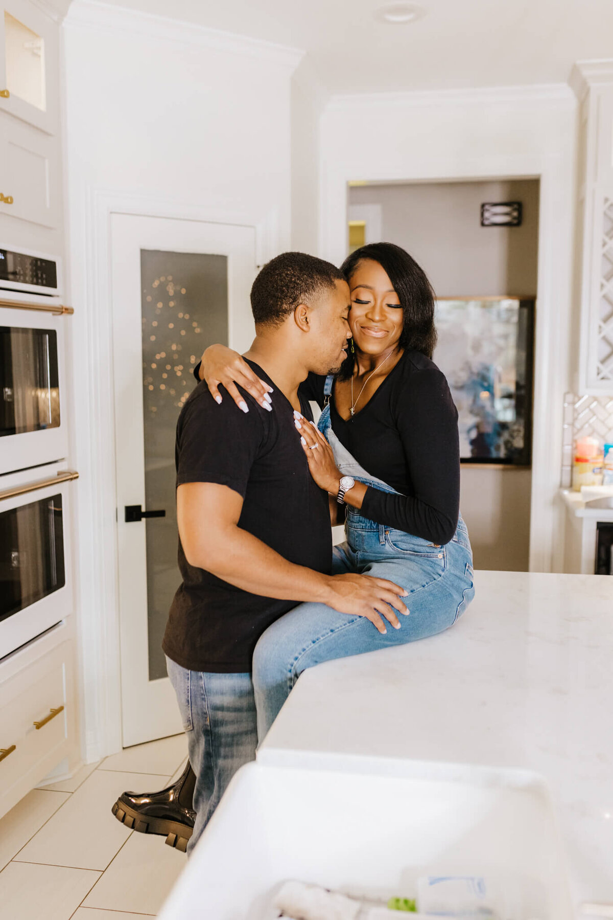intimate portrait of couple in kitchen during in home lifestyle phot session
