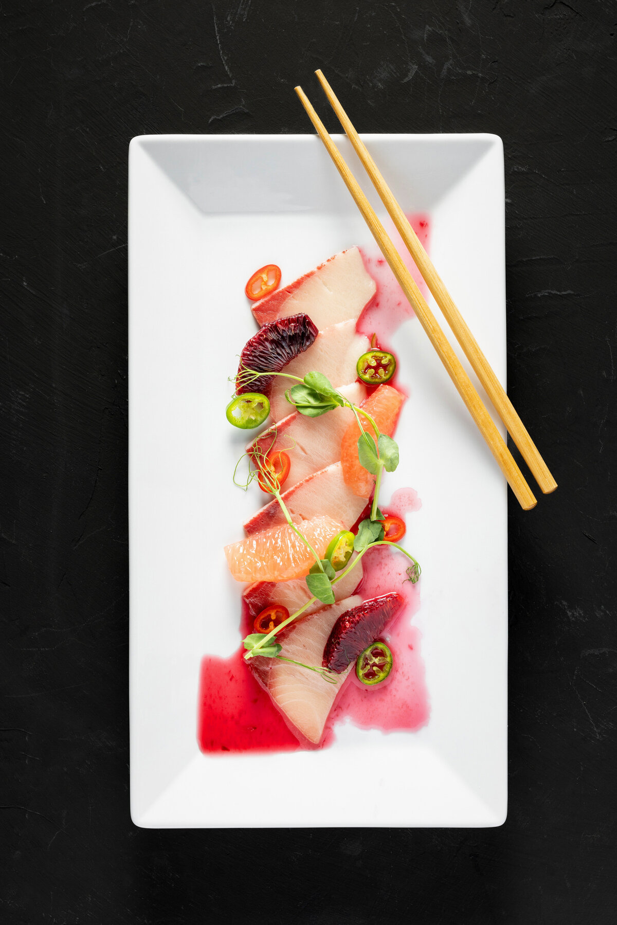 Raw fish sliced on a plate