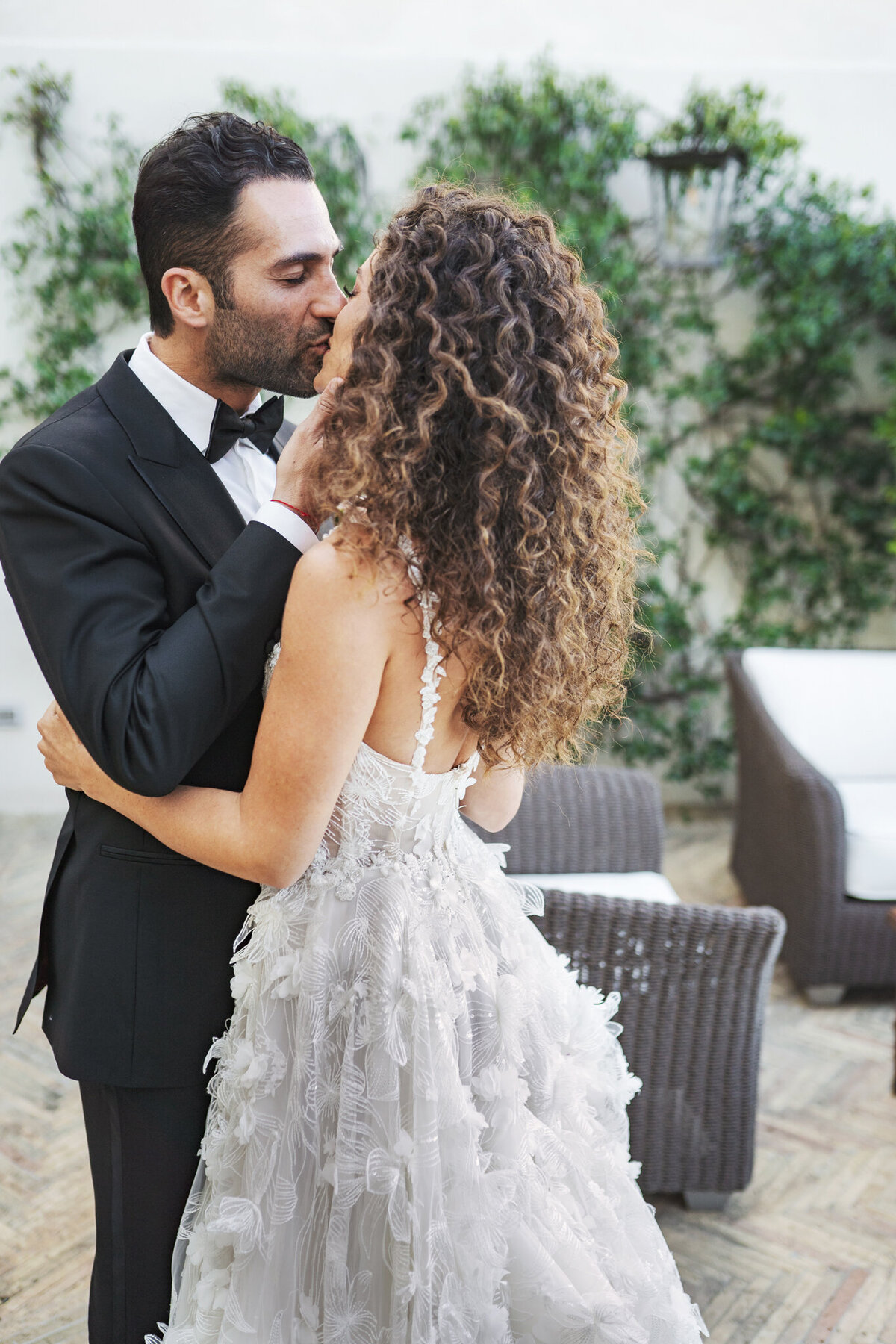 Bride and groom first kiss on a destination wedding day in Italy