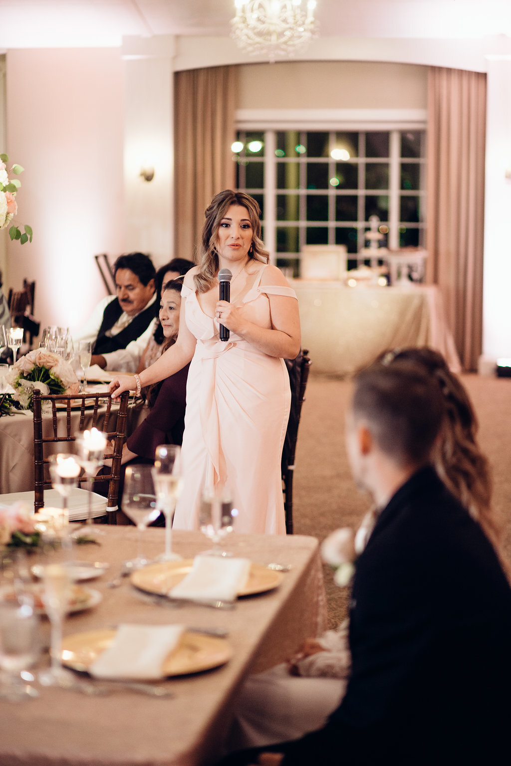 Wedding Photograph Of Woman Speaking To The Bride And Groom In Microphone Los Angeles