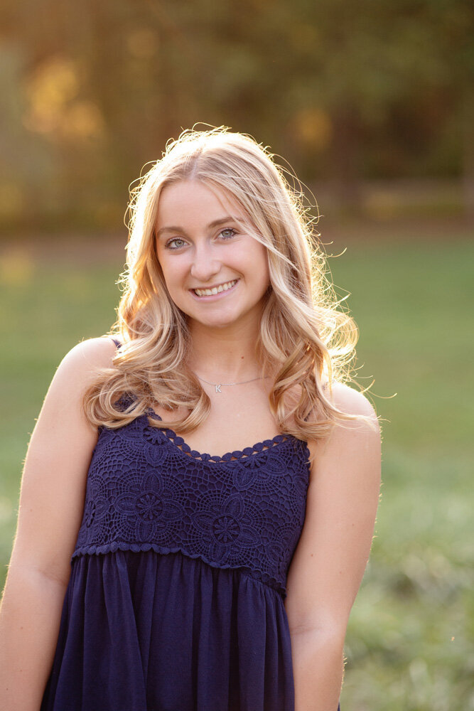 Senior session of young woman in a purple dress