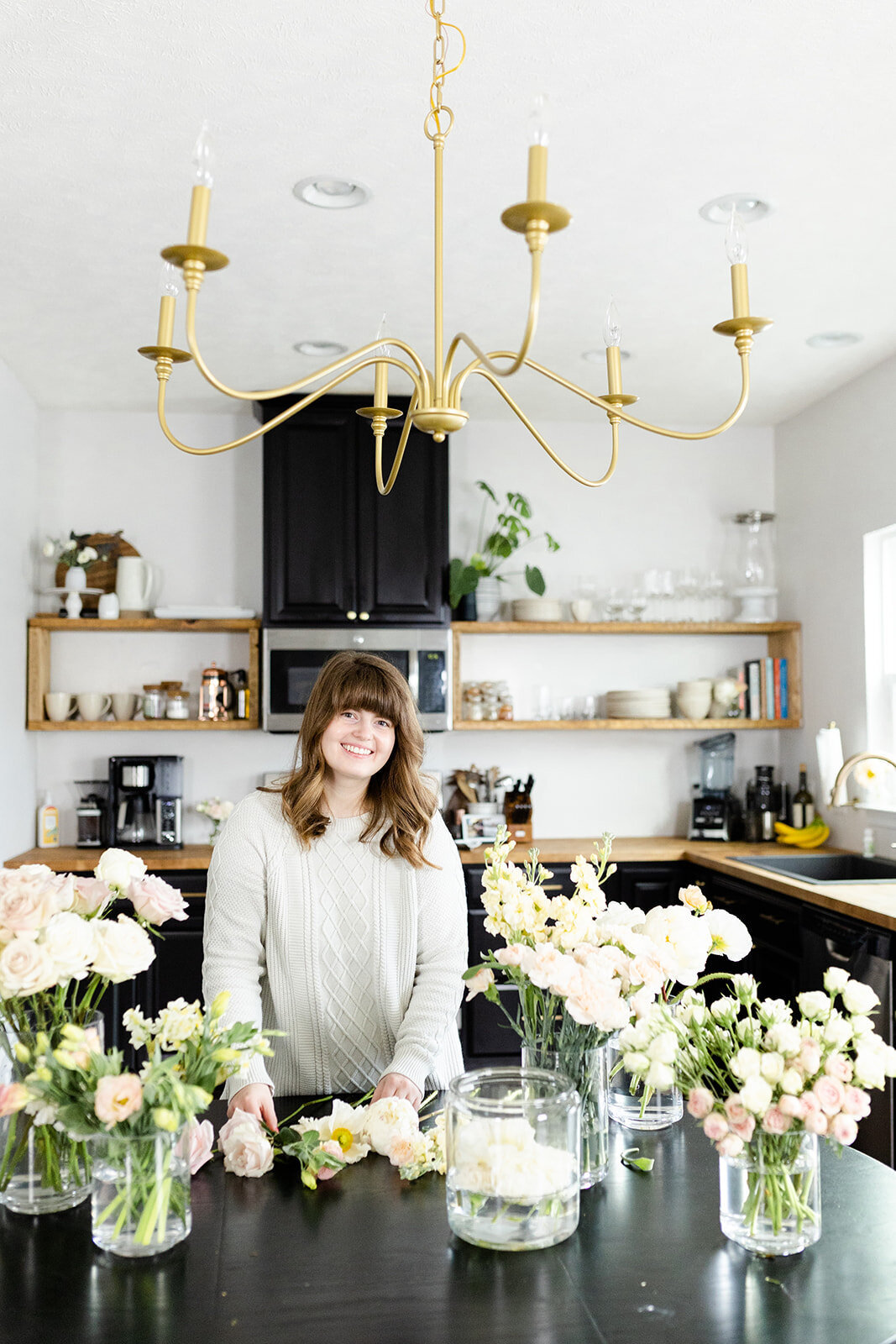 Florist standing with flowers for brand photos
