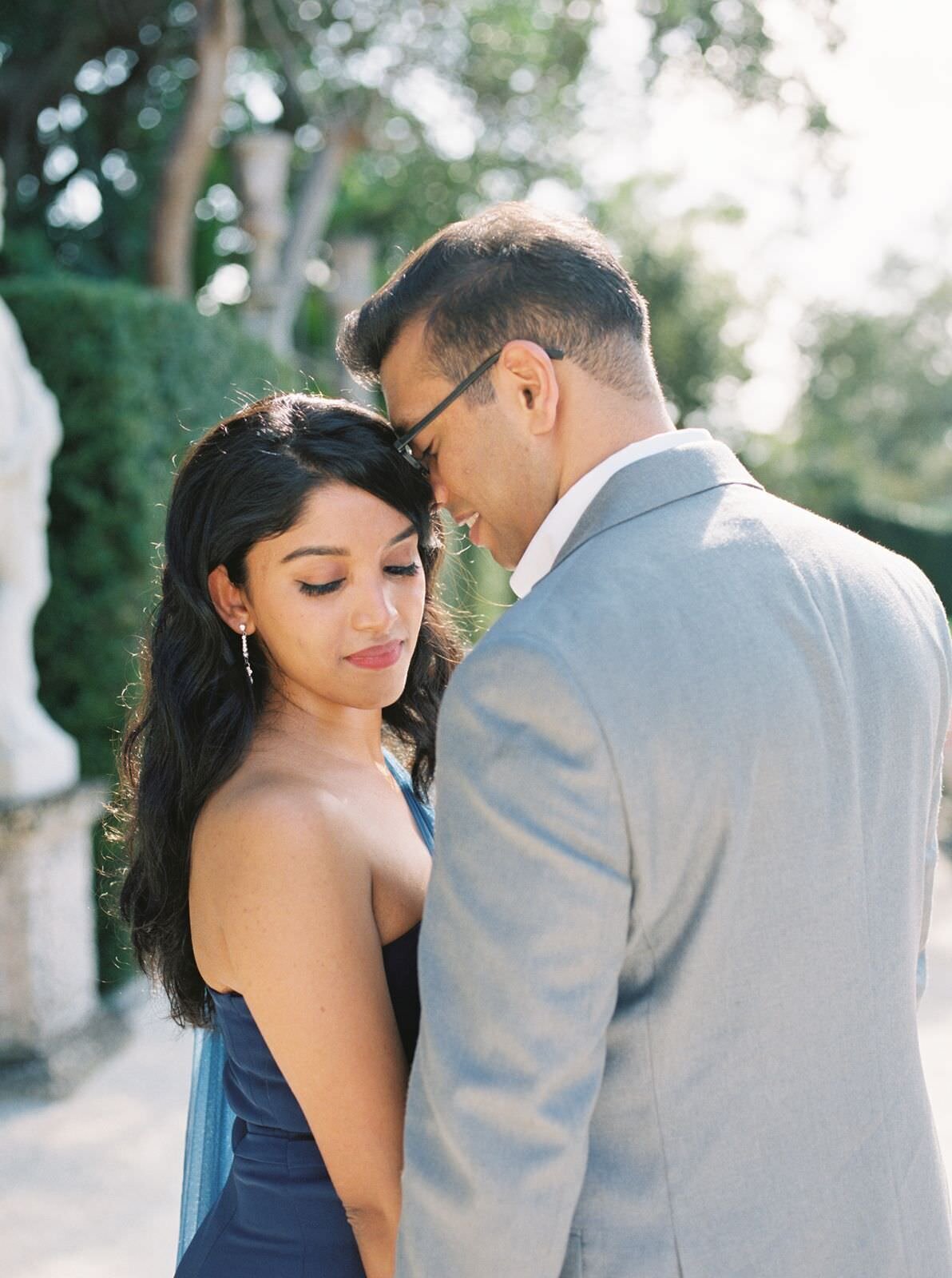 Sweet-embrace-between-bride-and-groom-at-engagement-session-at-Vizcaya-Museum-with-Sarah-Sunstrom-Photography