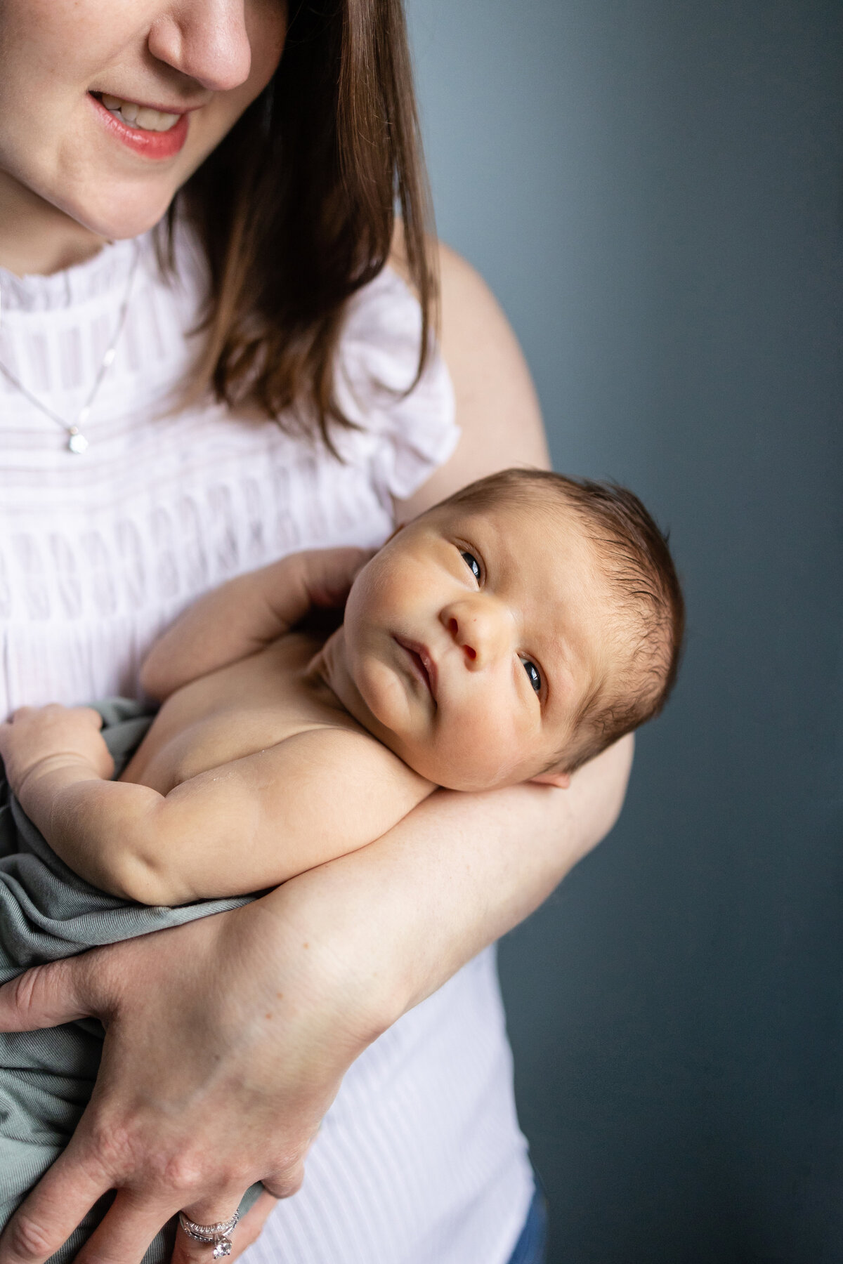 Baby in mothers arms - Jen Madigan - Naperville Lifestyle Photographer