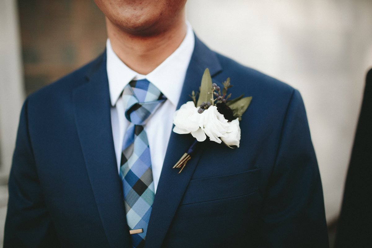 winter white and blue boutonniere