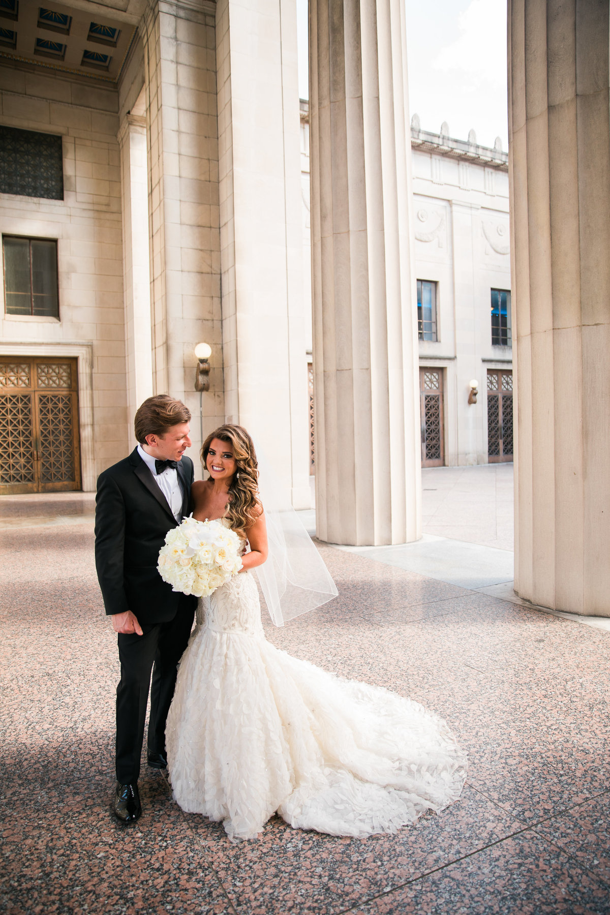 Bride and Groom in the columns at War Memorial in Nashville.