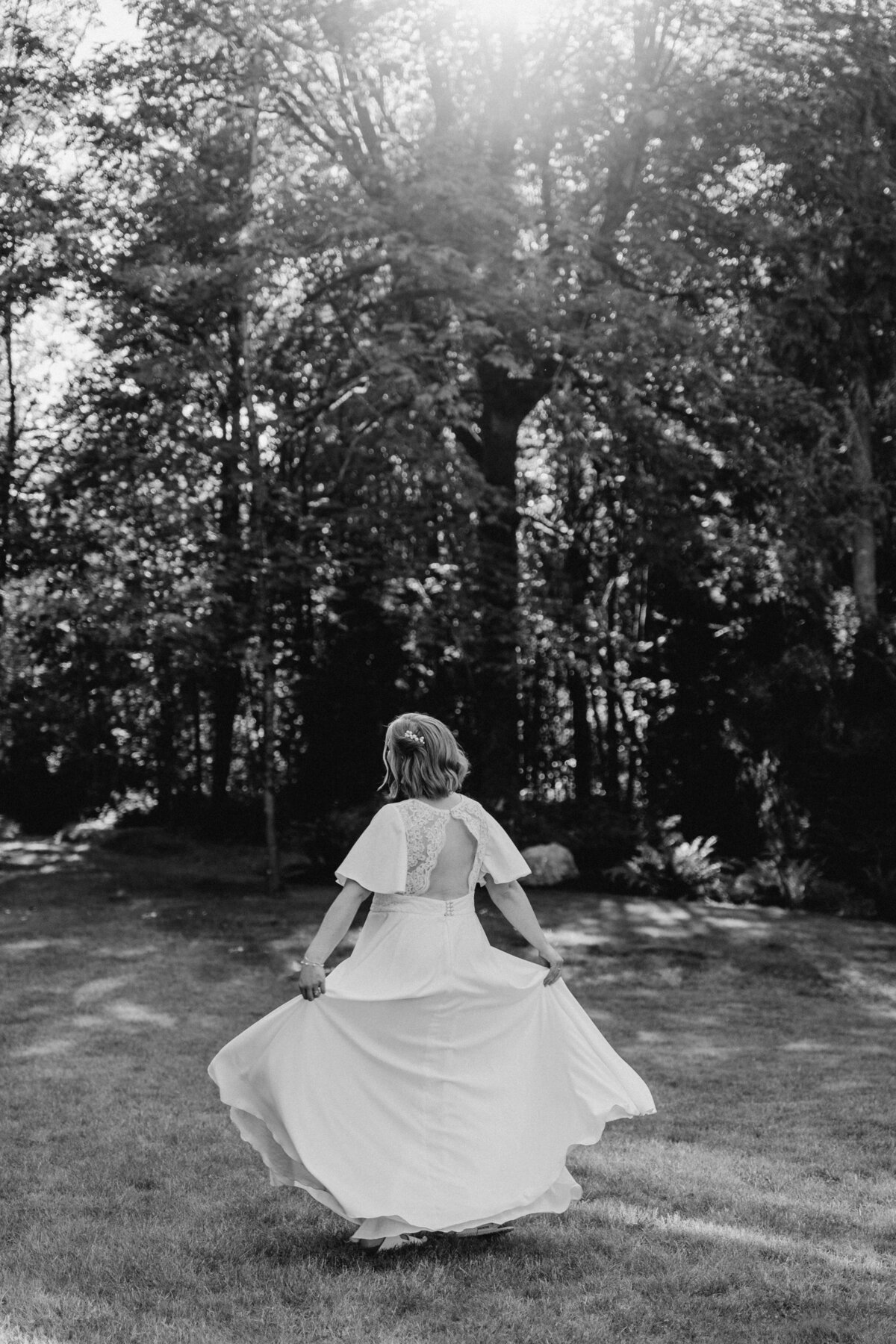 The bride twirls in the wedding dress she made herself.