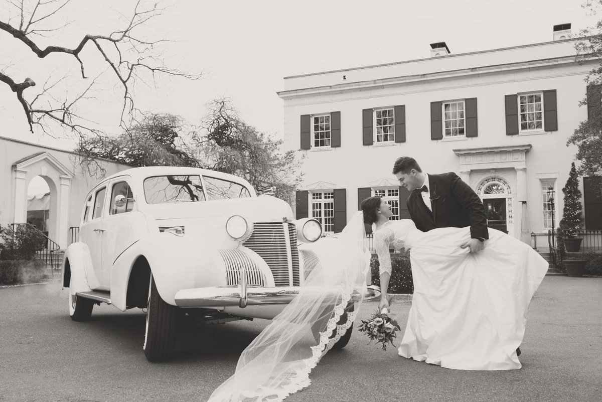 Bride and groom next to their wedding vintage car at The Mansion at Oyster Bay