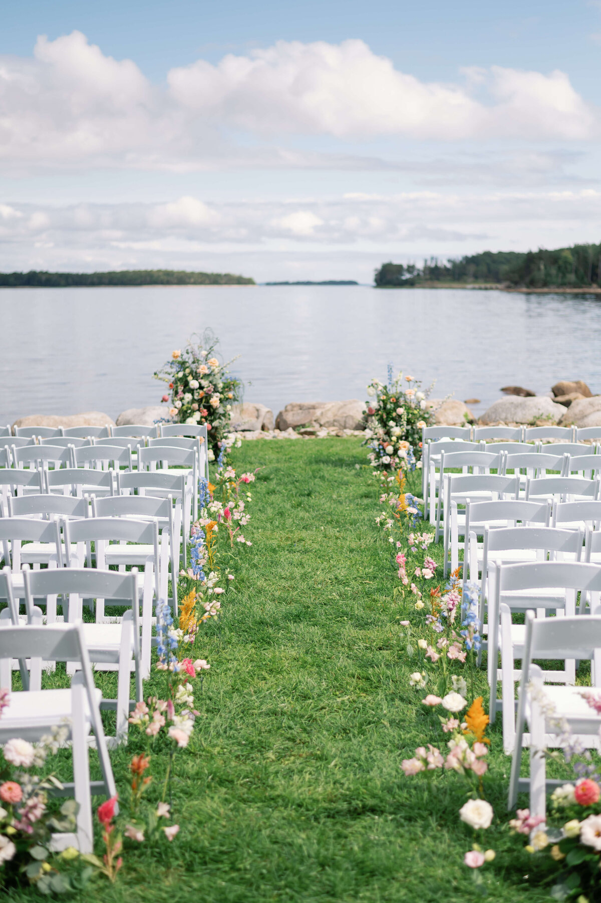 Wedding chairs for wedding ceremony overlooking ocean at Oak Island Resort Wedding, Nova Scotia