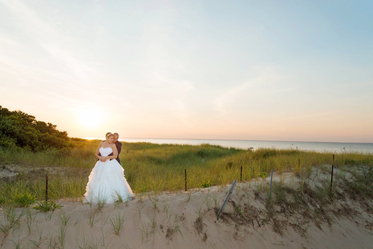 photo of bride and groom on the beach during sunset from wedding at Pavilion at Sunken Meadow
