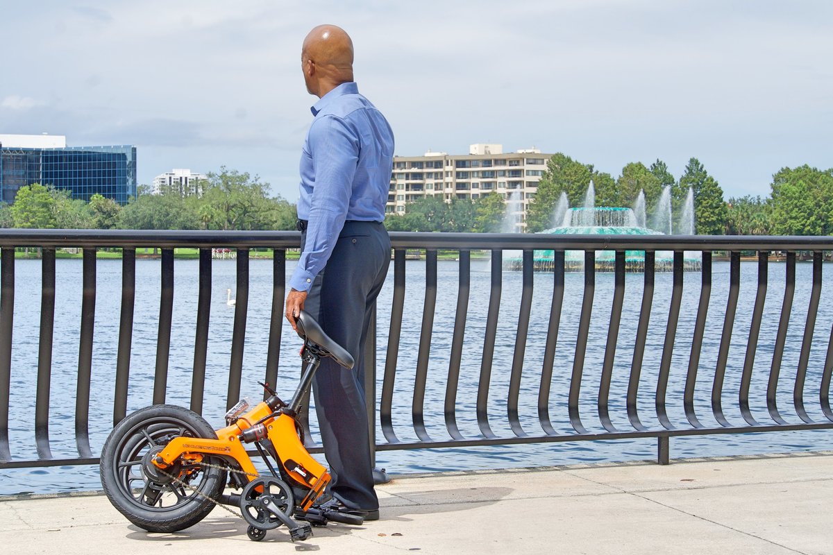 Orange Go-bike M4 Folded up on Lake Eola Orlando