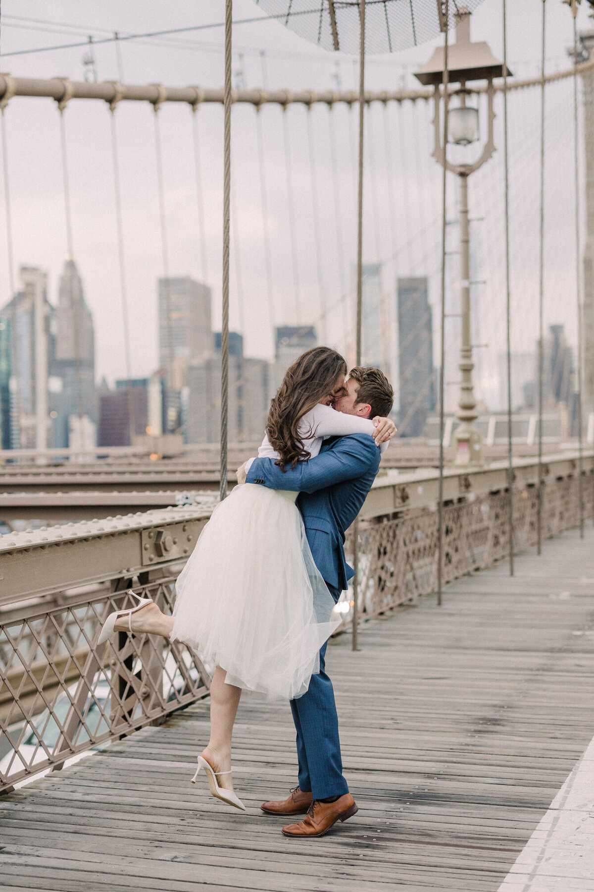 An engagement session on the Brooklyn Bridge in NYC at sunrise