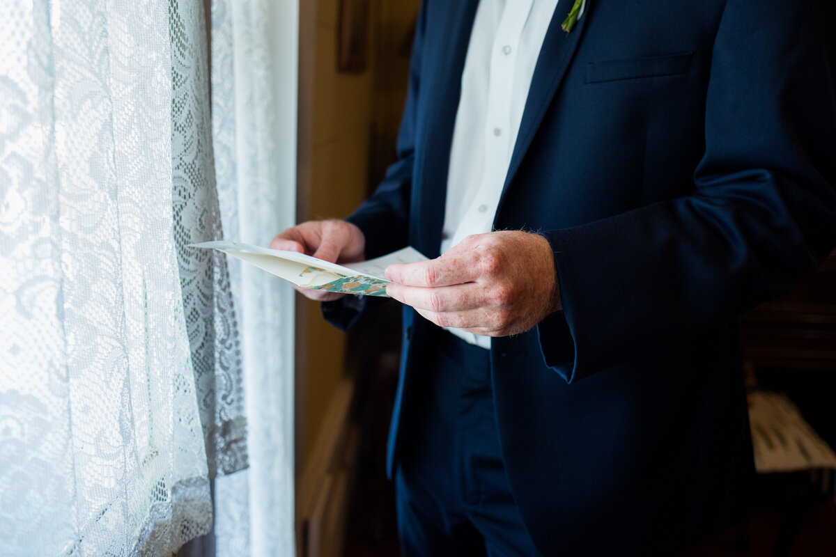 Christine Quarte Photography - Groom Reading Letter from Bride