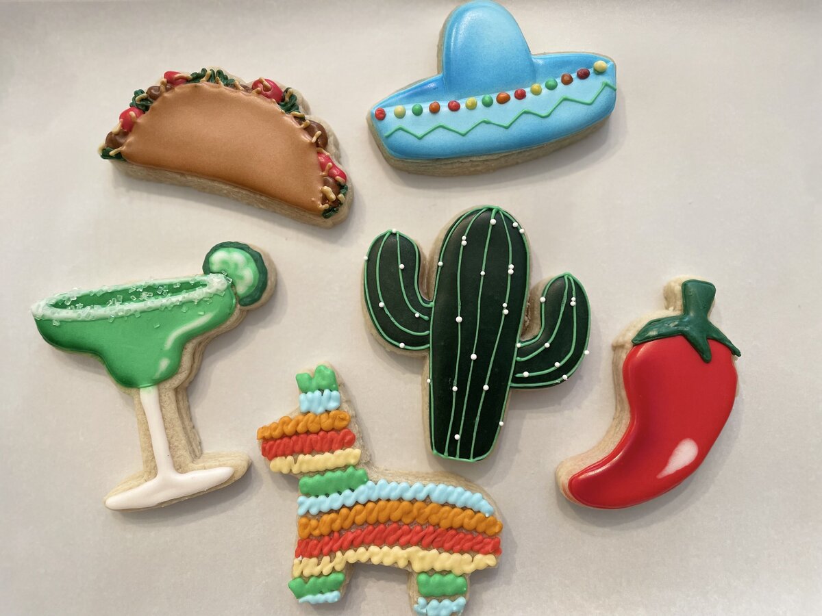Custom-designed fiesta cookies with intricate icing details, perfect for birthdays, made in Gilbert.