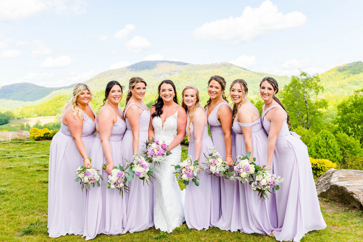 bride and bridesmaids in lavender dresses