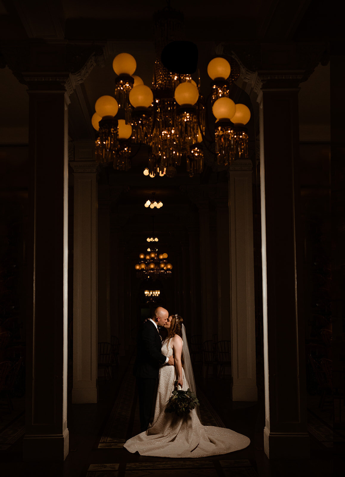 bride and groom share a kiss in omni mount washington wedding venue photo by cait fletcher photography