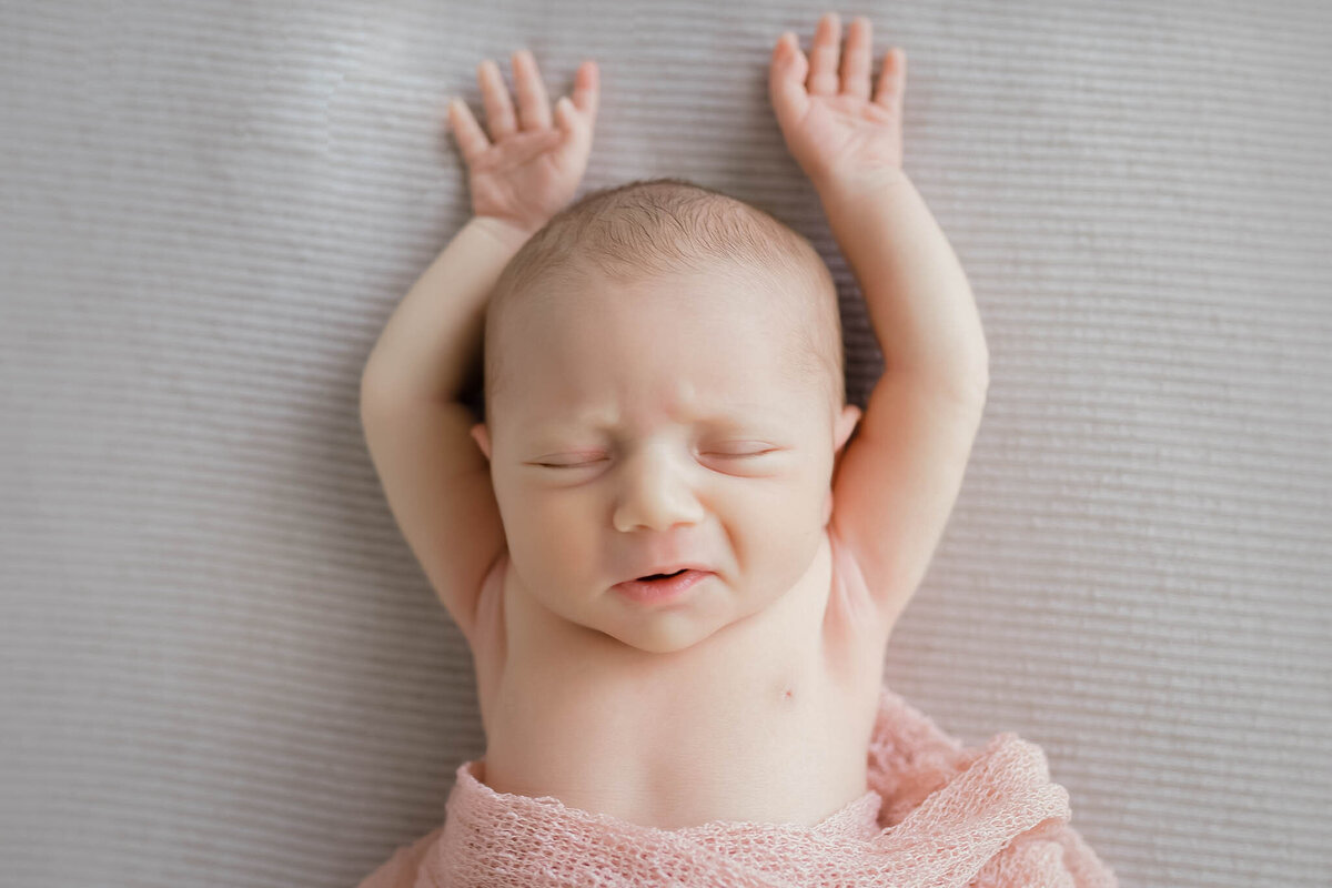 newborn baby stretched out