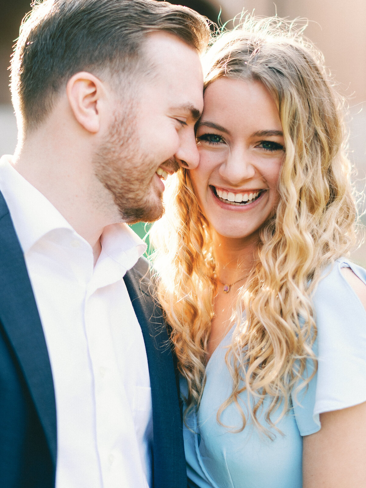 groom in love with bride in blue with blonde hair