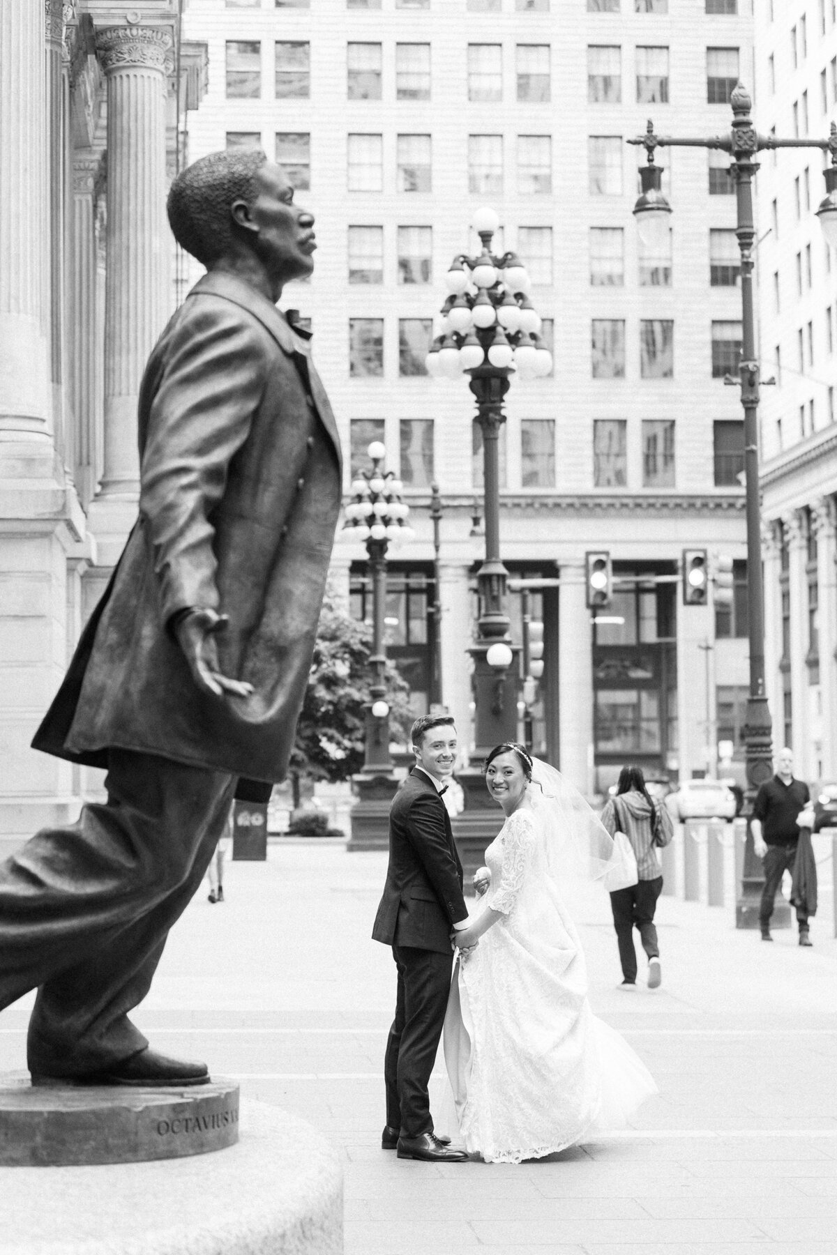 Bride and groom walking in downtown Philadelphia