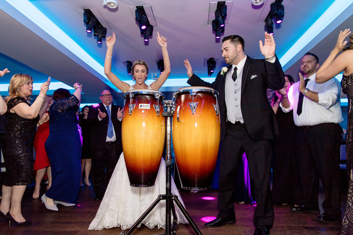 Bride and groom playing the drums at Harbor Club at Prime