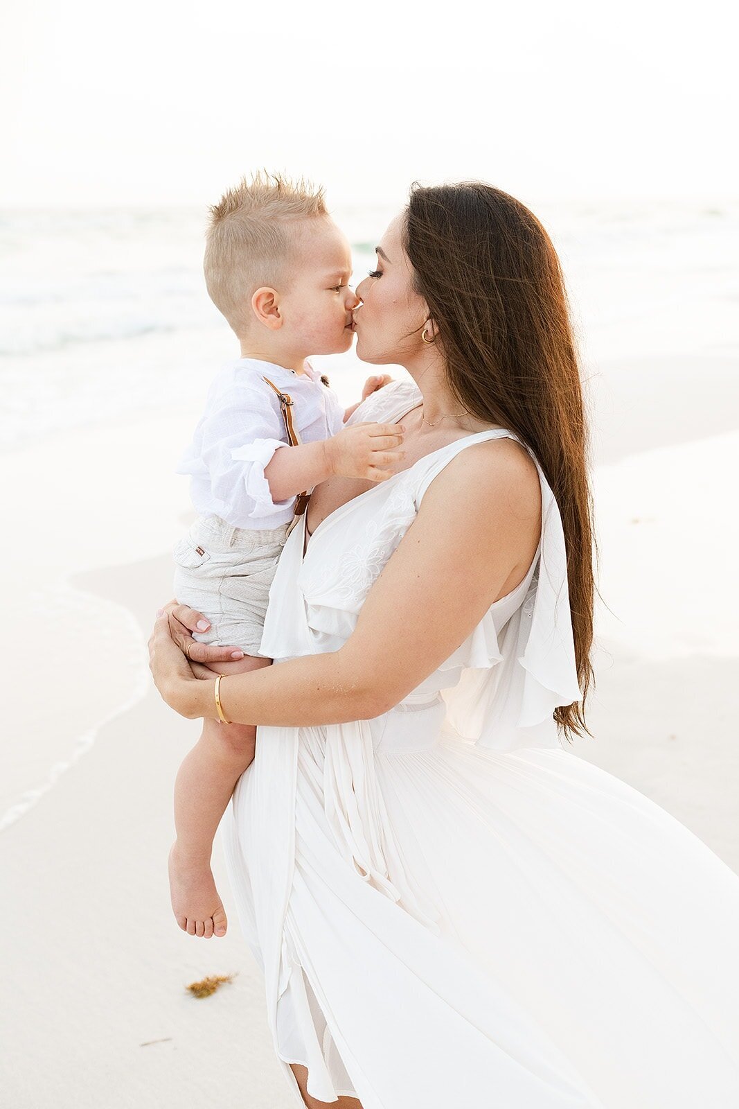 a mom kissing her toddler by Destin family photographer