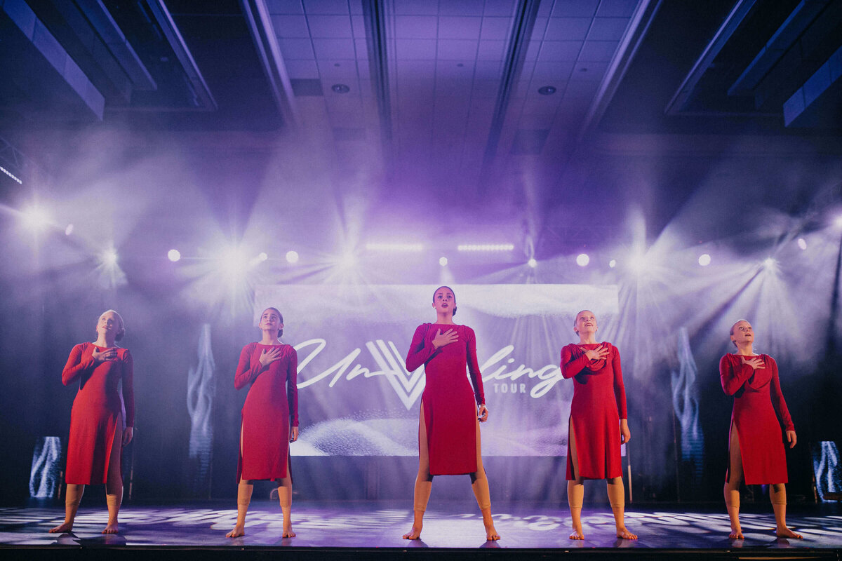 Dancers in red dresses at recital in Southlake Texas