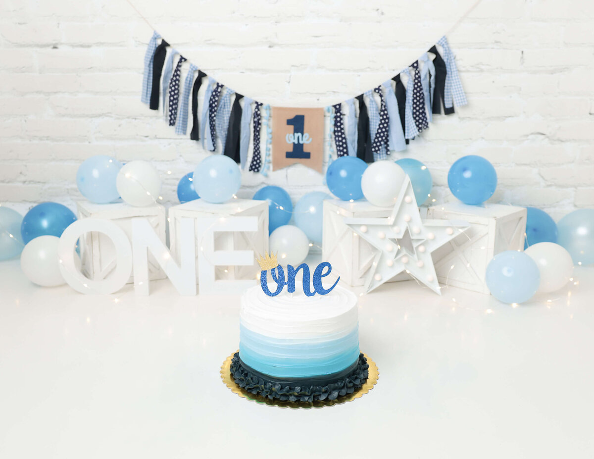 A blue-themed cake smash in Rochester, NY.
