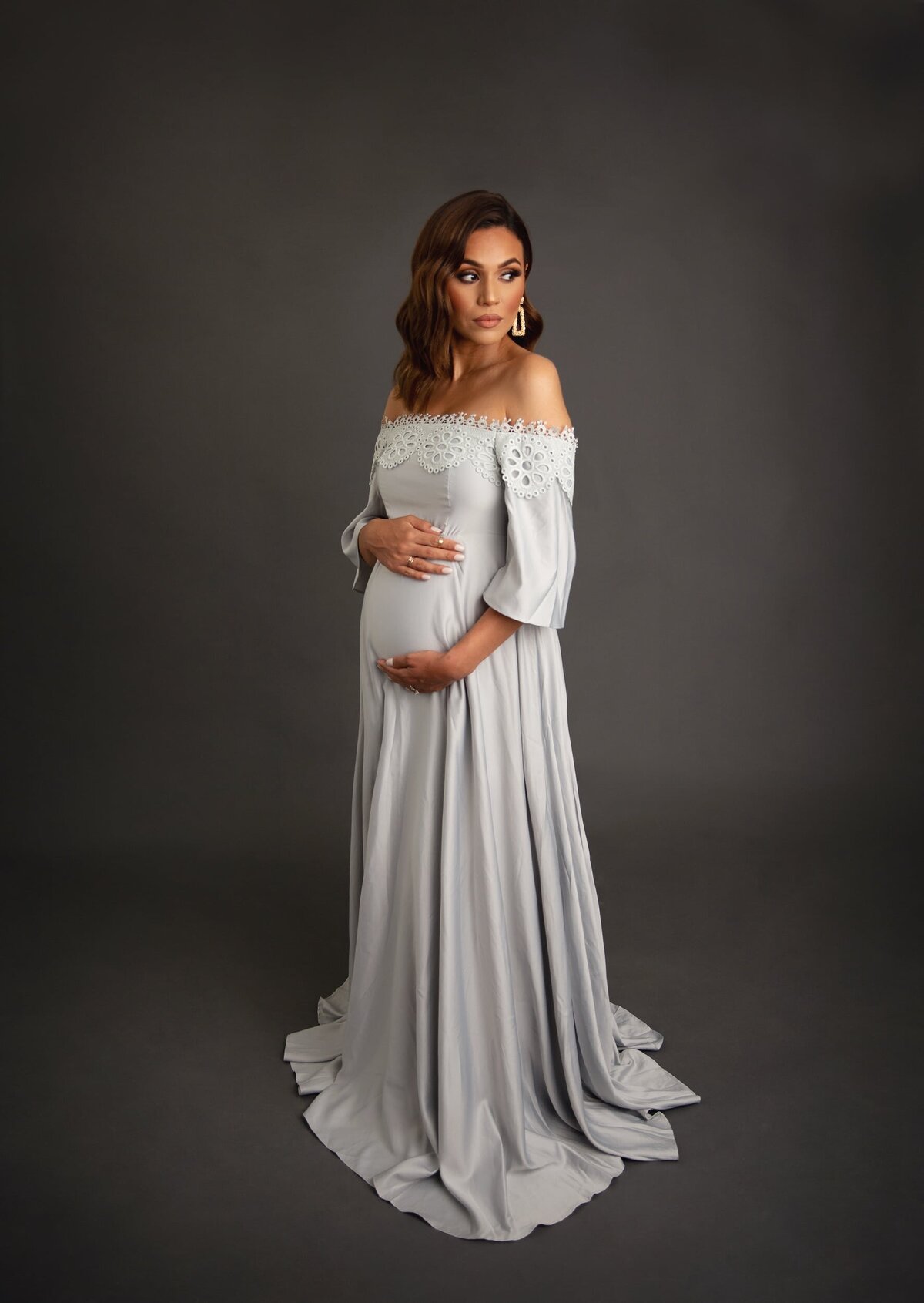 Maternity studio portrait silver dress