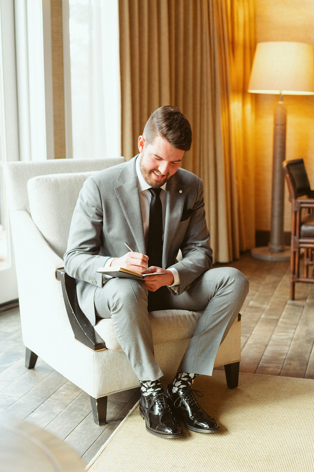Groom writing a letter to his bride.