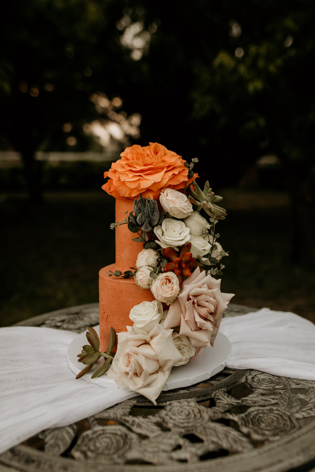 two tier wedding cake with southwestern flowers