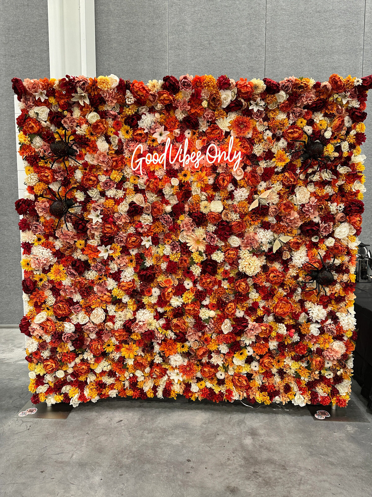 Autumnal Bloom floral wall featuring warm fall hues and rustic florals from Love In Bloom, romantic decor rentals based in Lethbridge, AB. Featured on the Brontë Bride Vendor Guide.