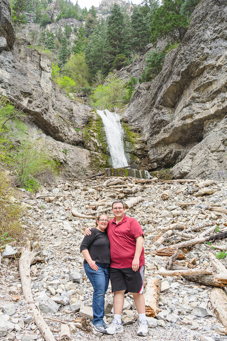 Melissa and Joseph smiling in front of Upper Falls, Provo Canyon in the summer