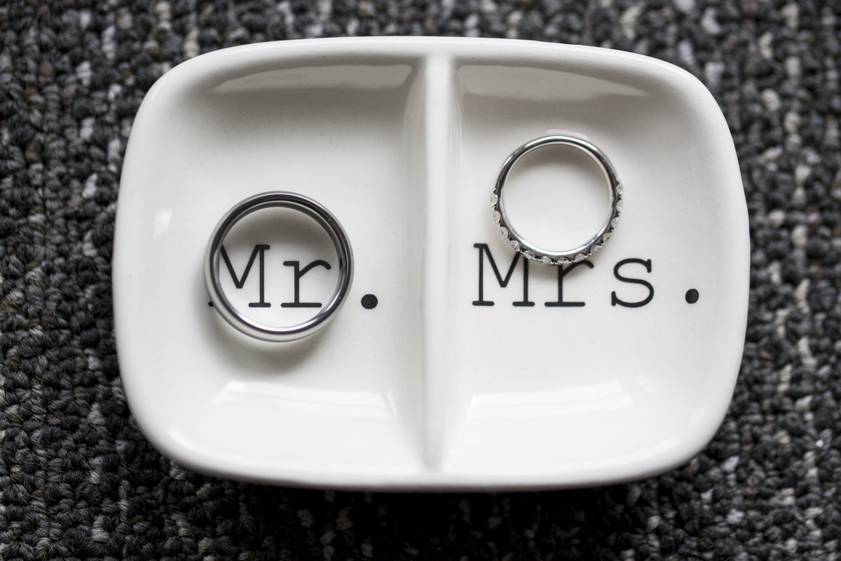 his and hers wedding rings in  dish