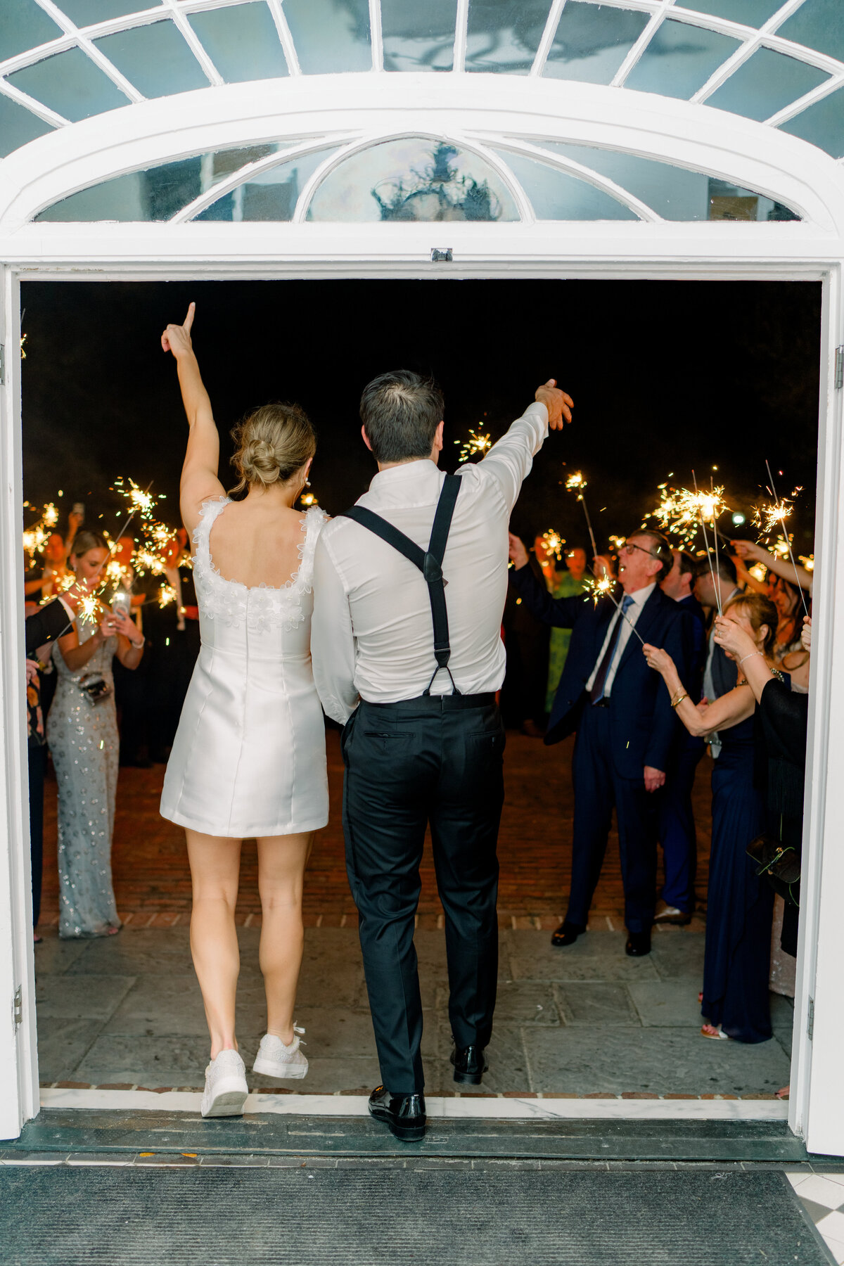 Sparkler exit at Lowndes Grove. Bride and groom bring the energy for this epic sparkler exit.