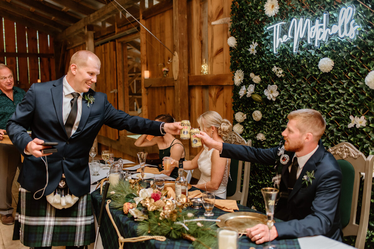 brothers fist bump during reception