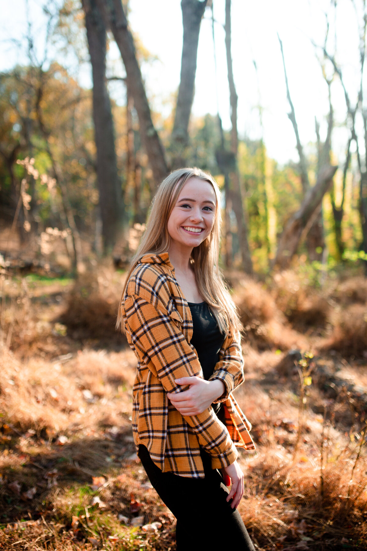 smiling-senior-portrait-in-woods