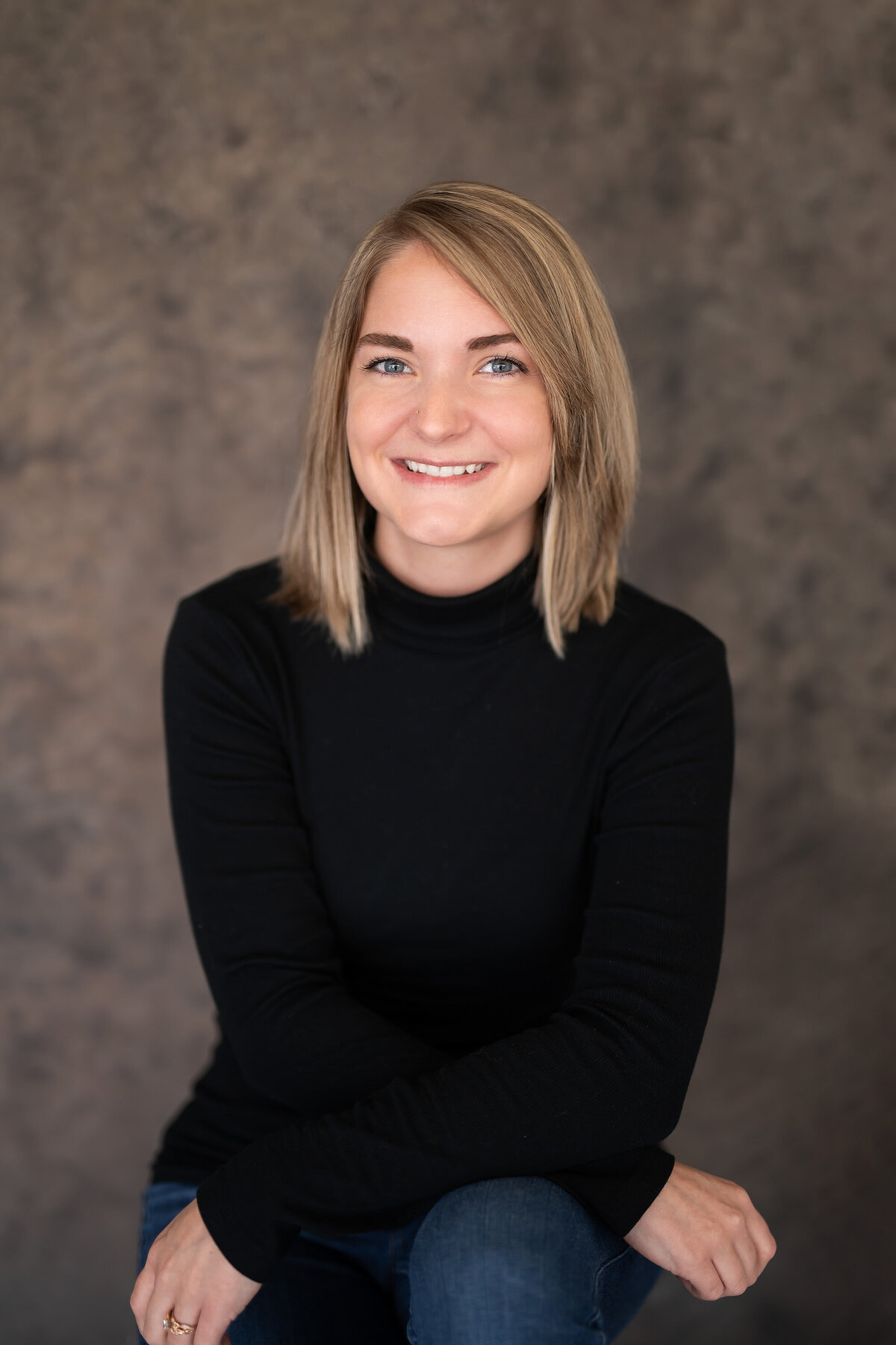 A Milwaukee business owner sits for a classic headshot in our Waukesha portrait studio.