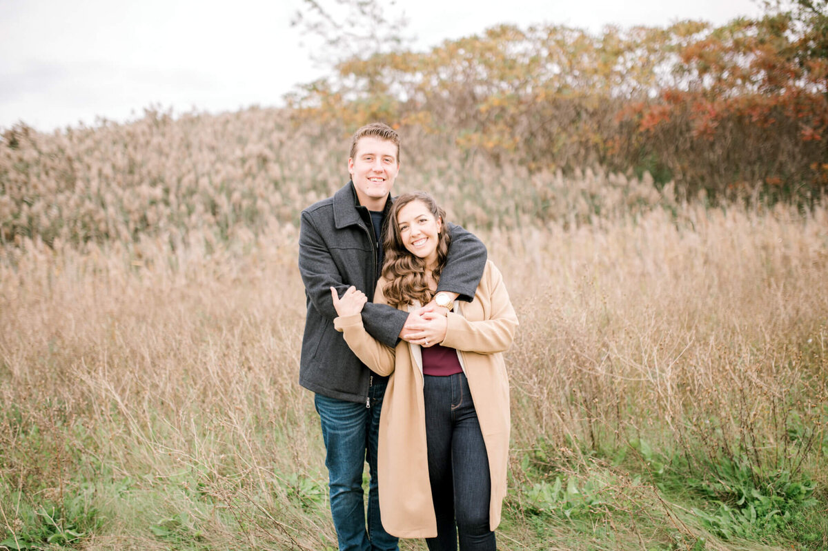 Couple in a field for their Toronto engagement session