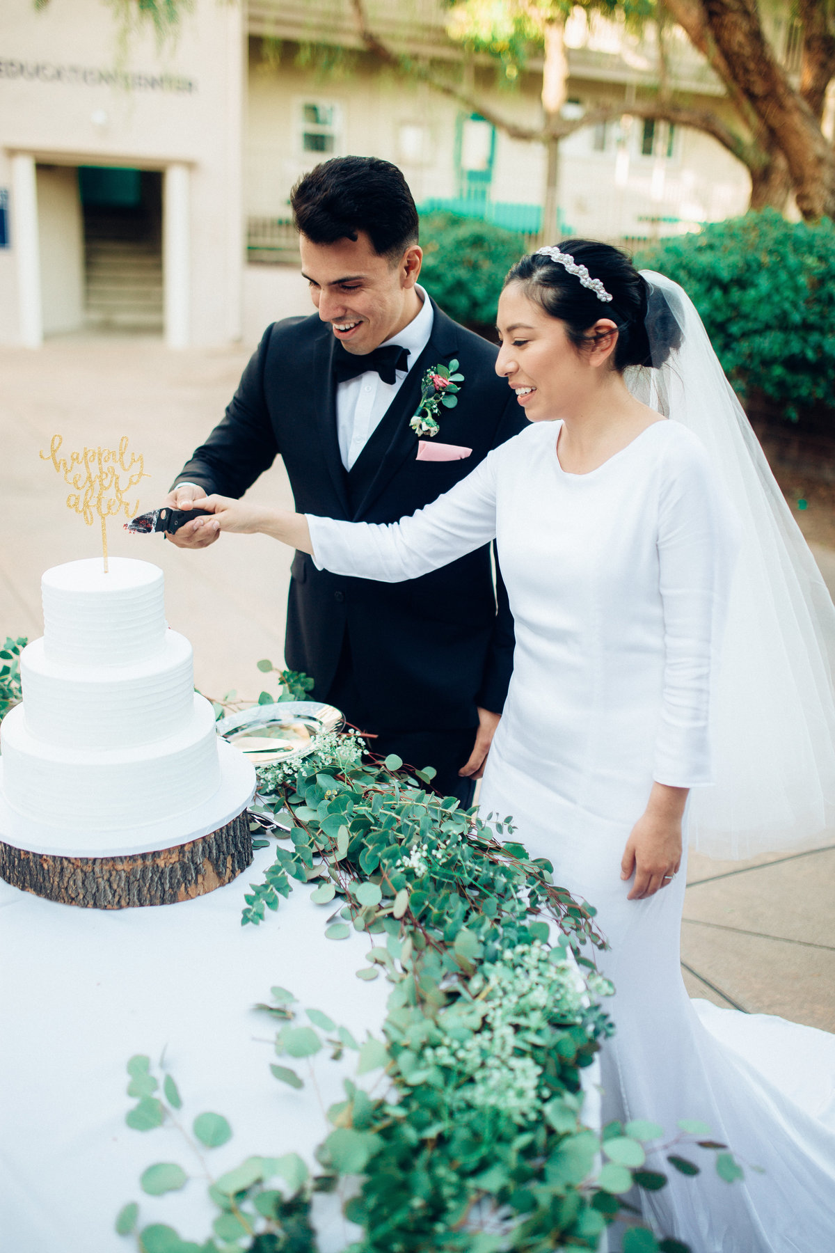 Close Up Wedding Photography of Couple Cutting Cake In California