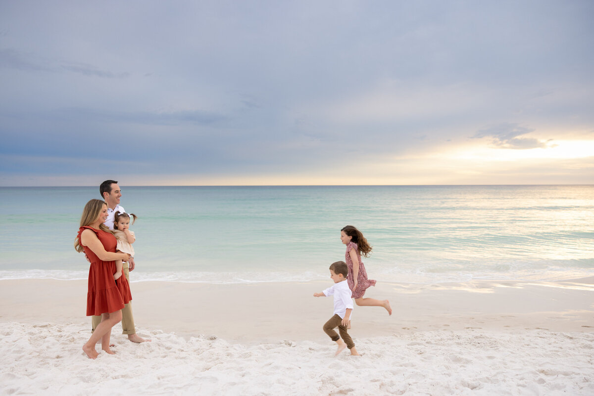 Two kids running towards their parents