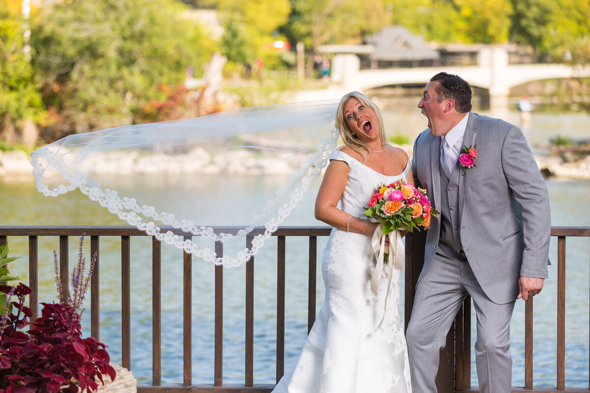 A bride and groom by Fox River at the Herrington Inn in Lake Geneva.