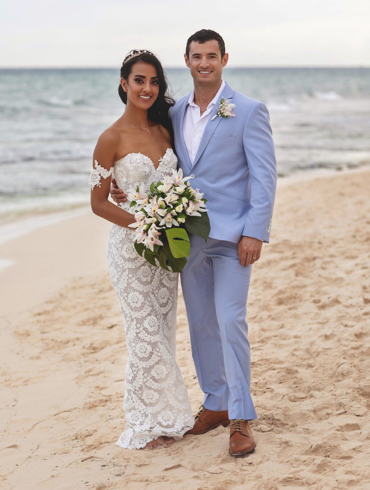 Portrait of bride and groom on beach at  Riviera Maya wedding.