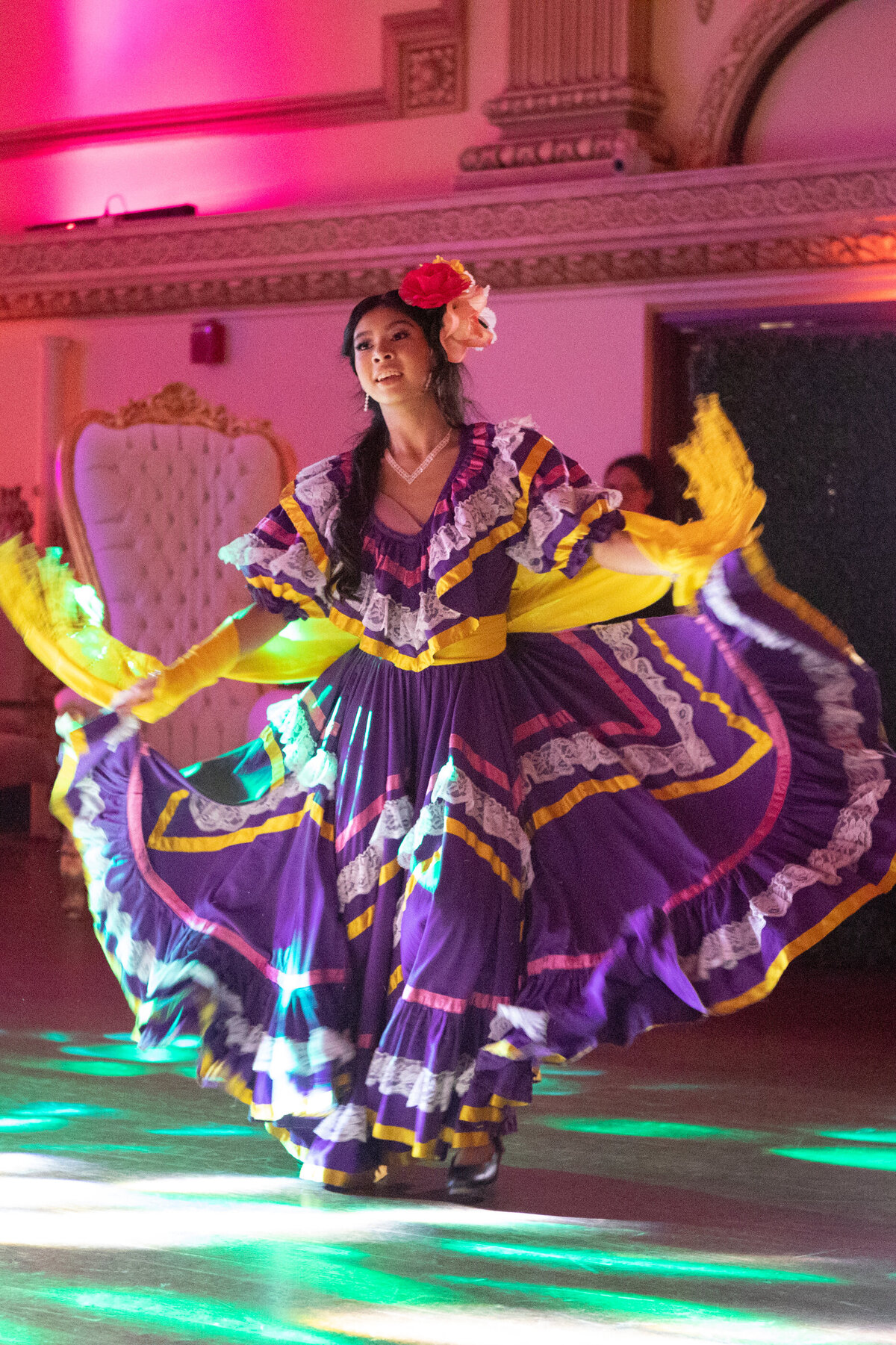 Mexican-American teenage girl in traditional yellow and purple Mexican dress choreographed dance New York Westchester quinceanera Photographer Milestone images