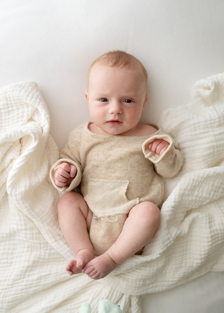 Newborn session of baby boy in knit outfit