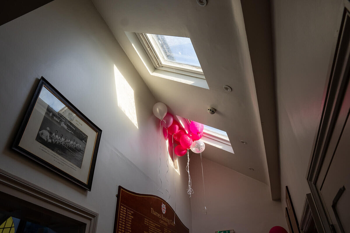 Balloons resting on ceiling window at TRC