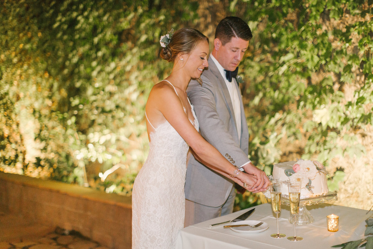 Bride and groom cut the cake at Firestone Vineyard wedding